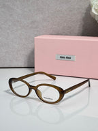 Eyeglasses with brown tortoiseshell round frames and clear lenses, temple logo.