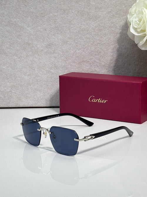 Cartier sunglasses with dark blue lenses, black frame, and gold-tone details