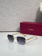 Cartier sunglasses with navy lenses and gold-tone frame with black side arms