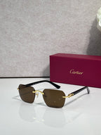 Cartier sunglasses with brown lenses and black frame with gold-tone accents