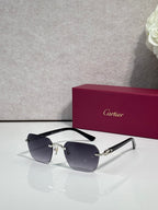 Cartier sunglasses with dark blue gradient lenses and black frame