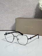 Black metal round eyeglasses with clear lenses and dark tortoise temple arms.