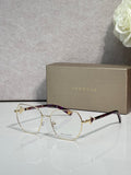 Gold metal round eyeglasses with clear lenses and dark tortoise temples, logo details.