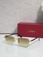 Cartier square sunglasses with light amber lenses, black frame, and gold-tone temples