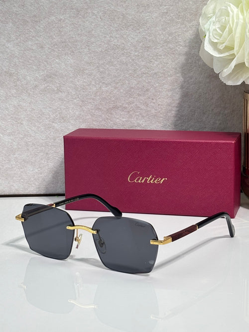 Cartier sunglasses with dark blue lenses, black frame, and gold metal accents.