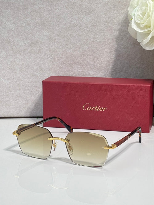 Cartier sunglasses with light yellow-tinted lenses, black frame, and gold metal accents.