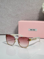 Round glasses with burgundy gradient lenses, pale frames, and gold-tone metal details