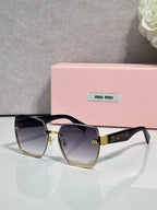 MiuMiu cat-eye sunglasses with dark tinted lenses and gold-tone metal details, side view