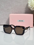 Square sunglasses with dark tortoiseshell frames and brown lenses