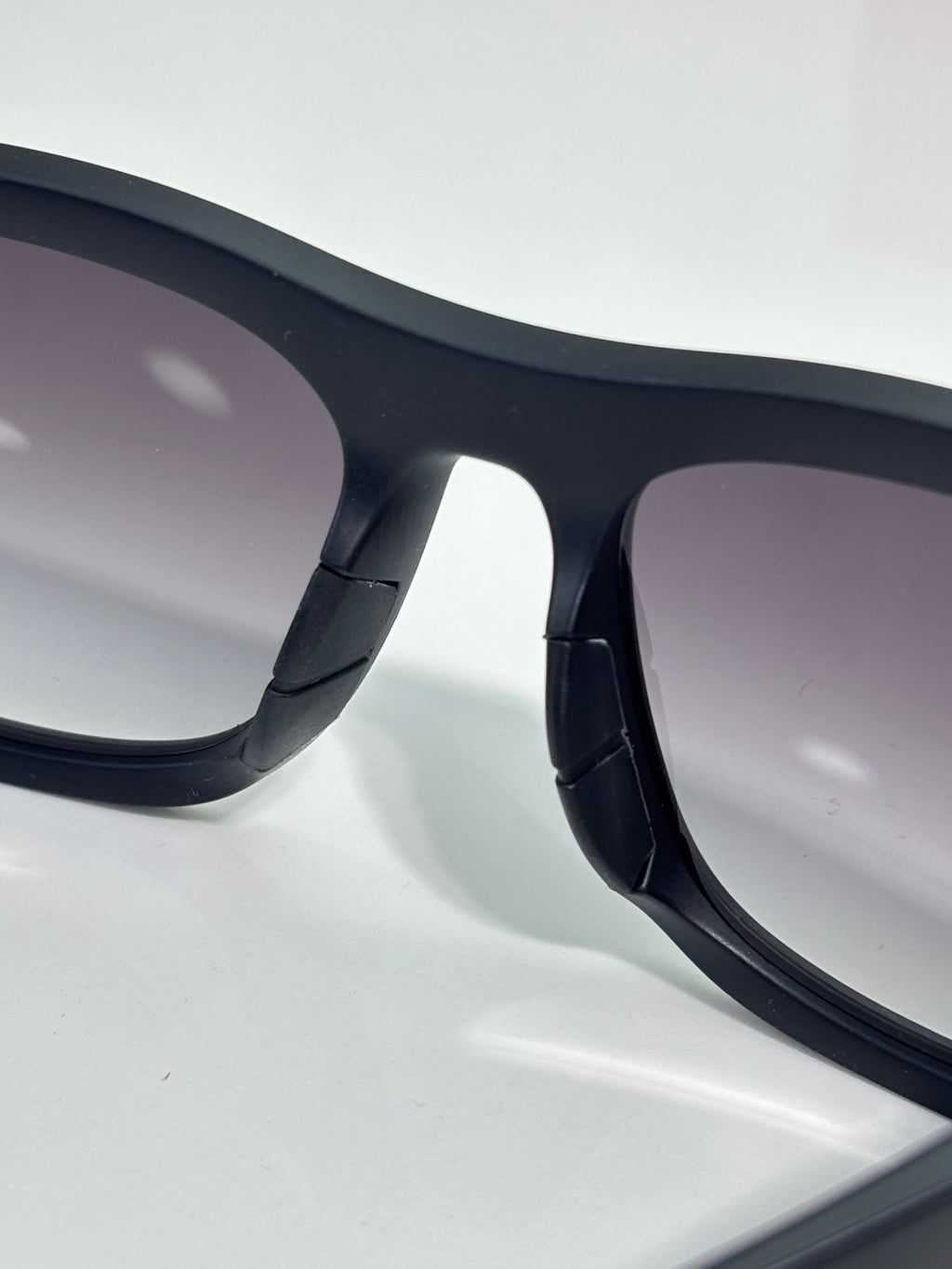 Prada sunglasses close-up of black temple arm detail