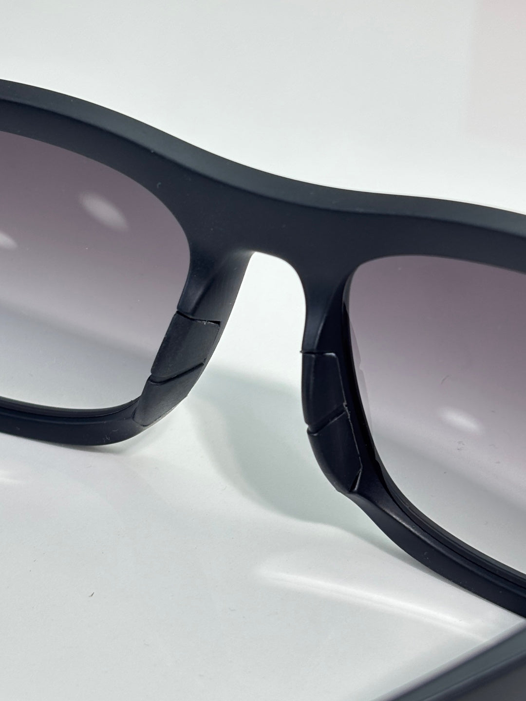Prada sunglasses close-up of black temple arm detail