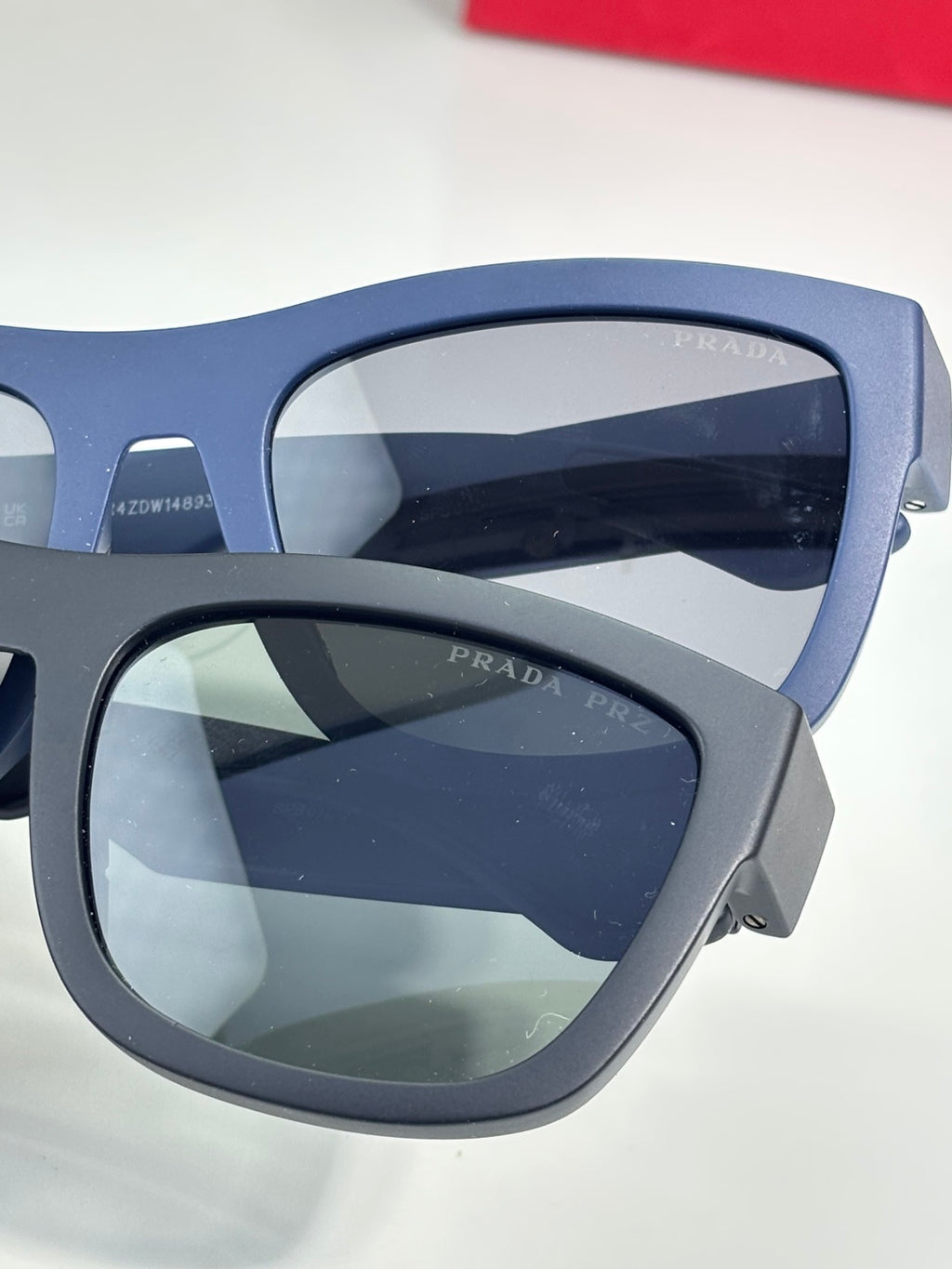 Prada sunglasses close-up with dark navy frames and dark lenses