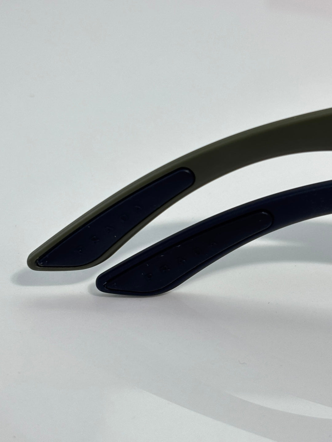 Prada sunglasses bridge and temples close-up with dark blue-tinted finish