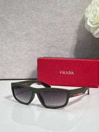 Prada sunglasses with dark frames and dark gray tinted lenses