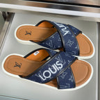 Navy Louis Vuitton sandals, cross strap design with tan leather lining, white soles