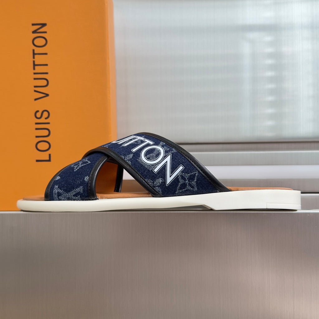 Navy Louis Vuitton slide sandal with wide monogram strap and white sole