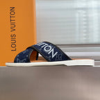 Navy Louis Vuitton slide sandal with wide monogram strap and white sole