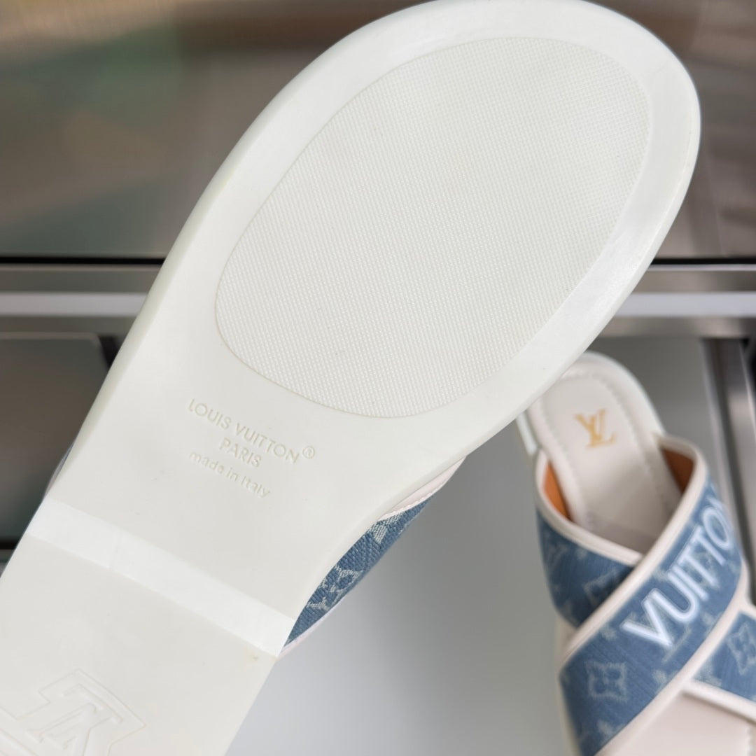 Louis Vuitton slide sandals, outsole close-up with embossed brand text