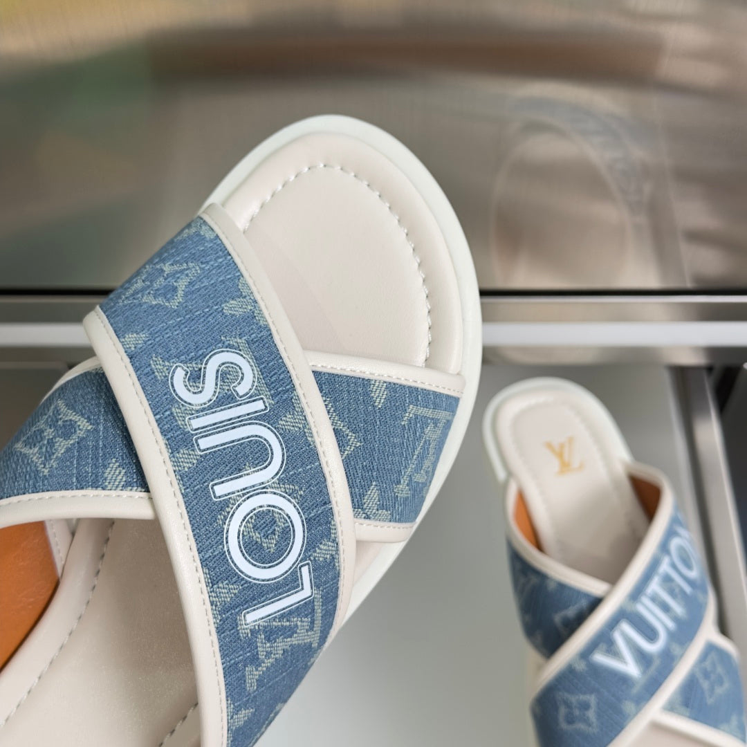 Louis Vuitton logo slide sandals, close-up blue monogram strap and white side trim