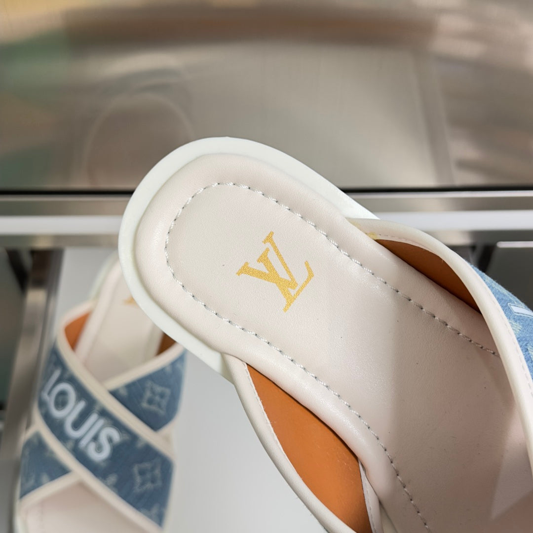 Louis Vuitton logo strap sandals, close-up of white leather footbed with gold LV