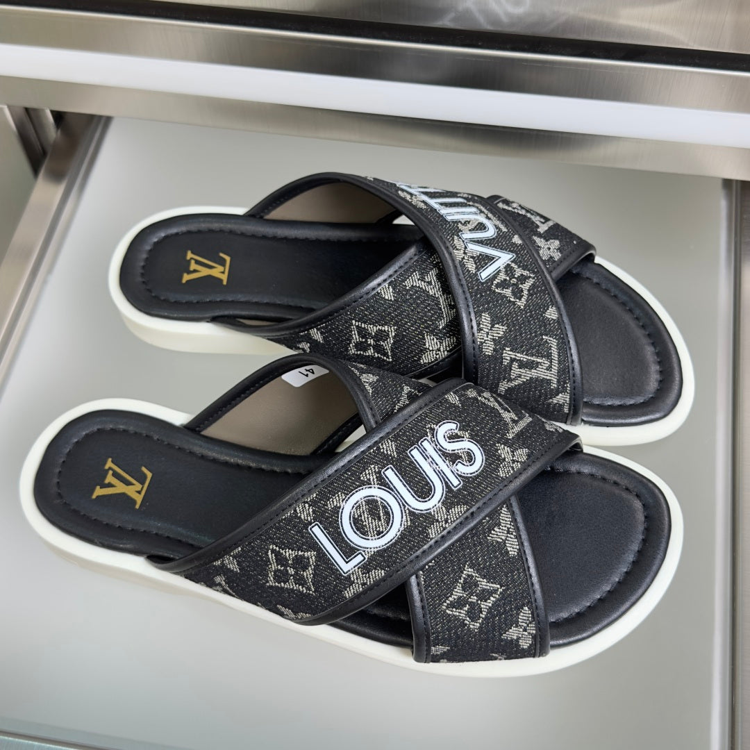 Louis Vuitton slide sandals, black monogram bands and cushioned white footbed.