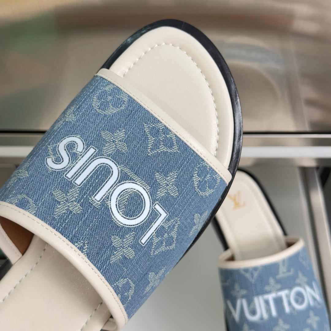 Louis Vuitton blue monogram slide sandal with white stitching and silver LV logo strap