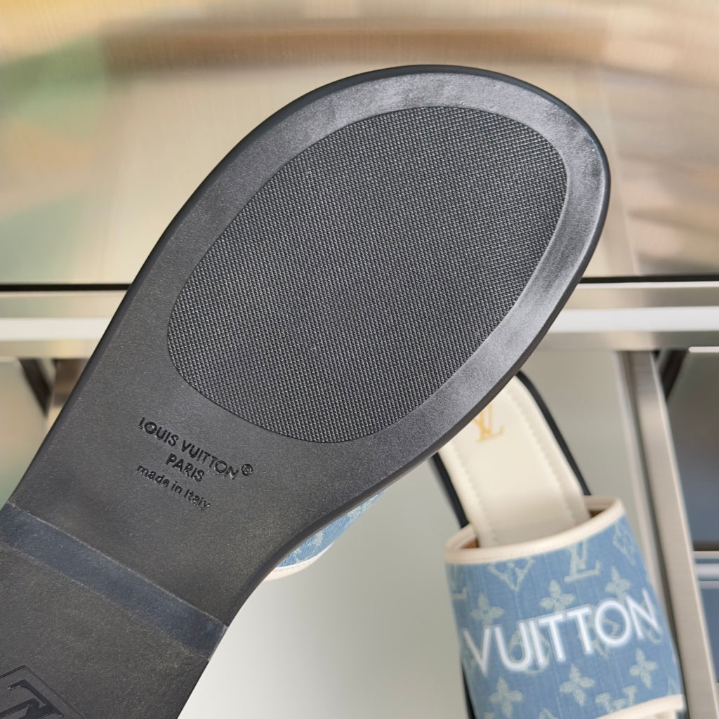 Louis Vuitton slide sandal outsole with textured gray rubber sole and embossed branding