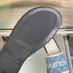 Louis Vuitton slide sandal outsole with textured gray rubber sole and embossed branding