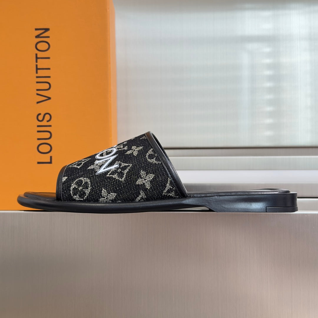 Louis Vuitton monogram slide sandals with black rubber sole and wide front strap
