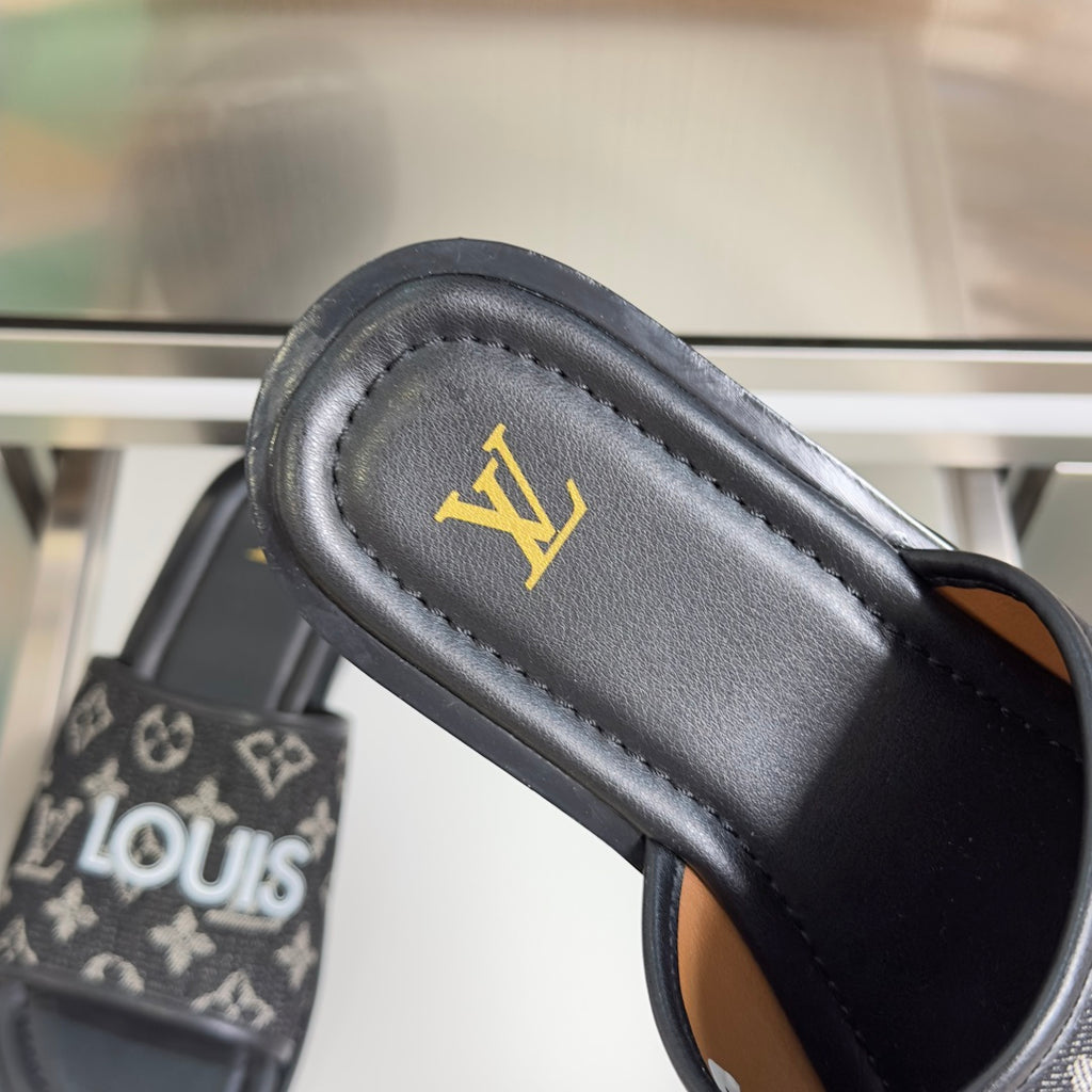 Louis Vuitton slide sandal footbed with gold LV logo on black leather-look