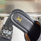 Louis Vuitton slide sandal footbed with gold LV logo on black leather-look