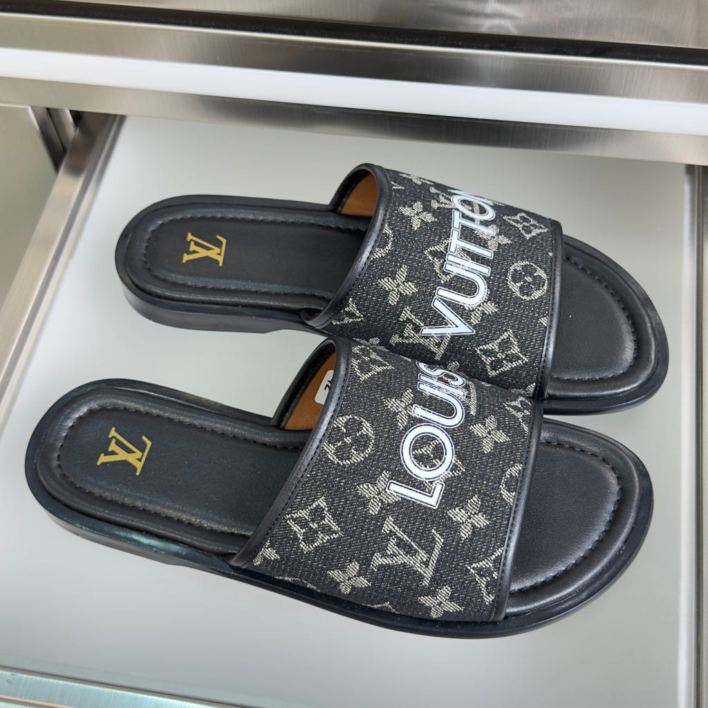 Louis Vuitton monogram slide sandals, black straps with LV-style logos and flat sole