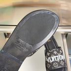 Louis Vuitton slide sandal outsole with textured tread and printed branding