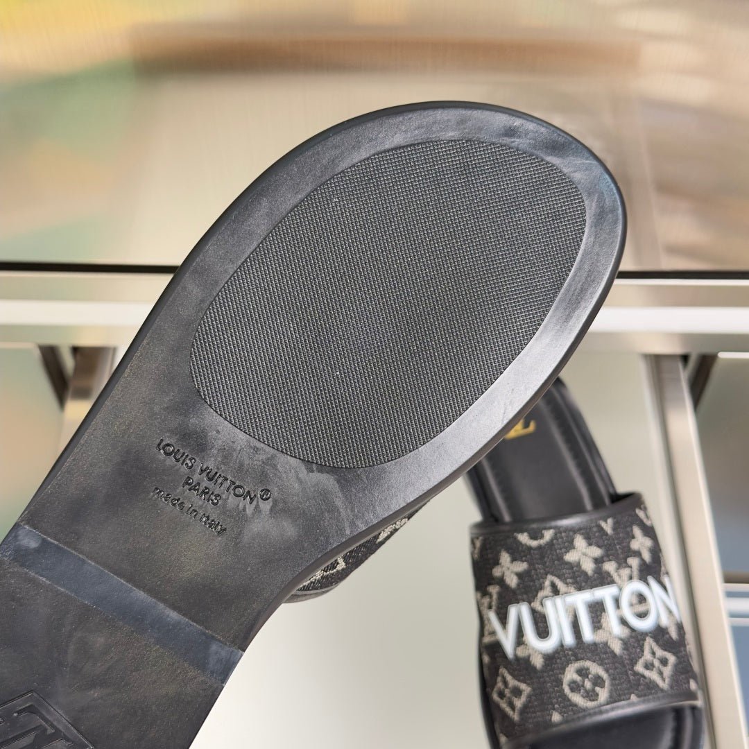 Louis Vuitton slide sandal outsole with textured tread and printed branding