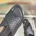 Louis Vuitton black woven slide sandal close-up of textured cross strap