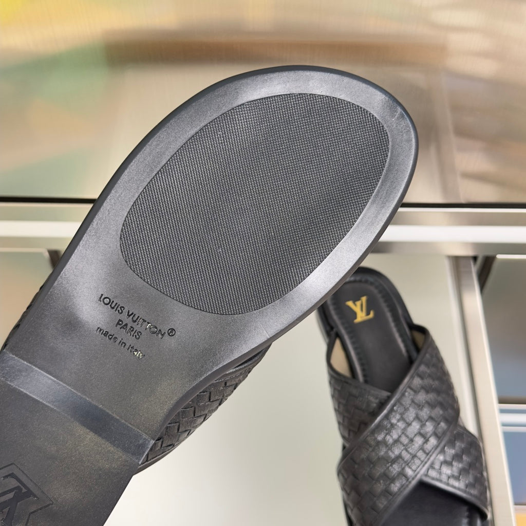 Louis Vuitton black leather slide sandal outsole with embossed Louis Vuitton Paris text