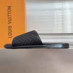 Black woven leather slide sandals with flat wide foot strap