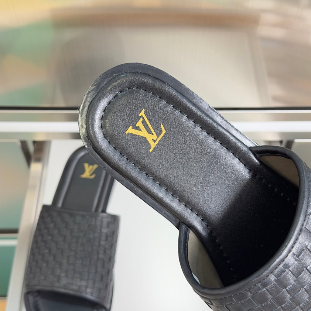 Black woven leather slide sandal with gold LV logo on footbed