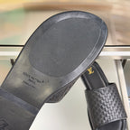 Black slide sandal insole with Louis Vuitton Paris branding