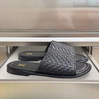 Black woven leather slide sandals with Louis Vuitton logo on straps