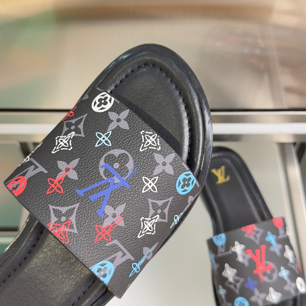 Louis Vuitton slide sandal strap close-up with multicolor monogram on black base