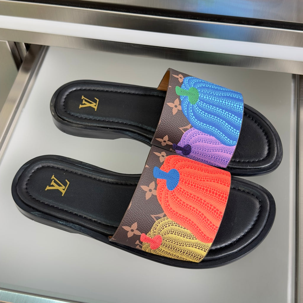 Pair of Louis Vuitton slide sandals with black footbed and multicolor monogram strap
