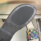 Louis Vuitton slide sandal outsole with textured tread and printed logo