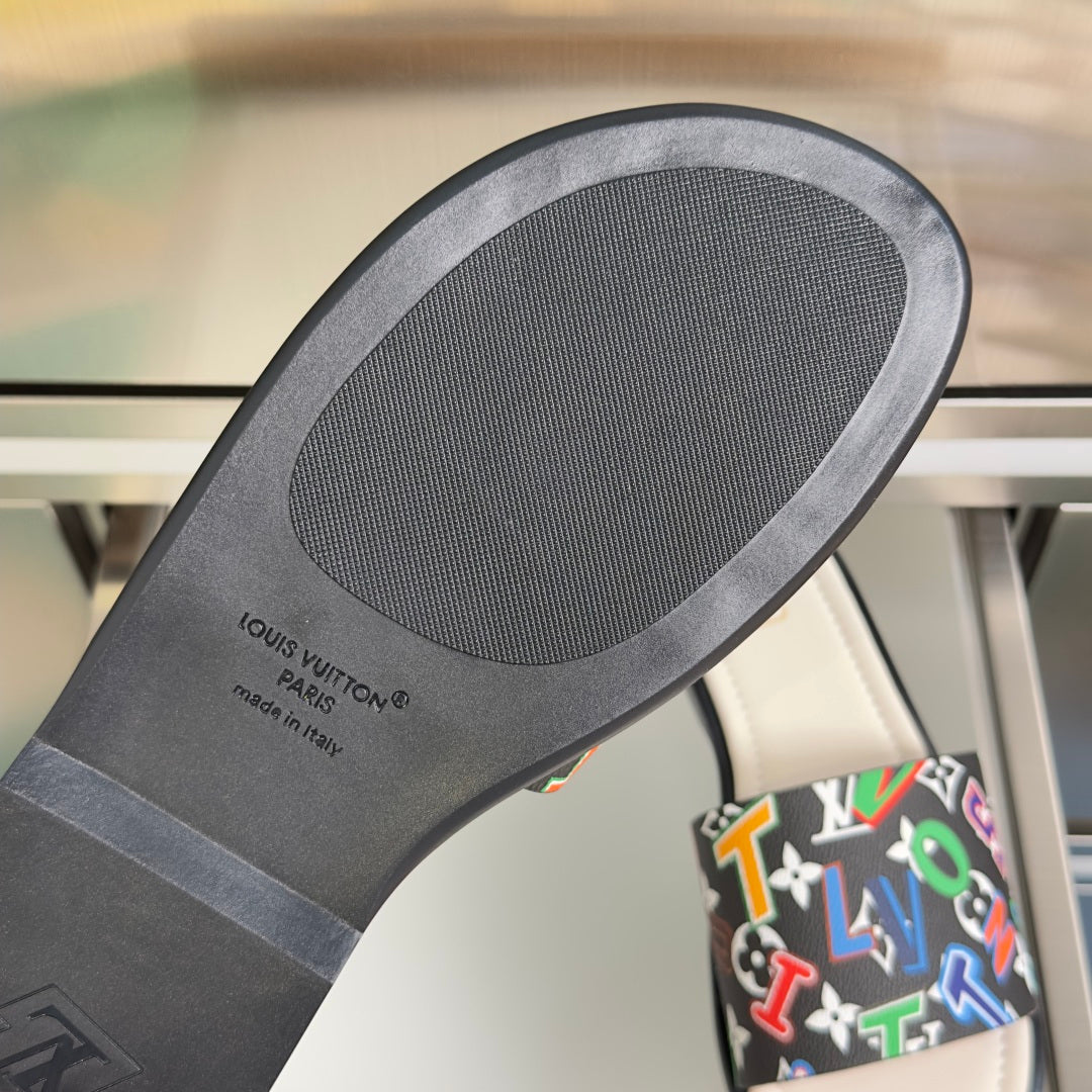 Louis Vuitton slide sandal outsole with textured tread and printed logo