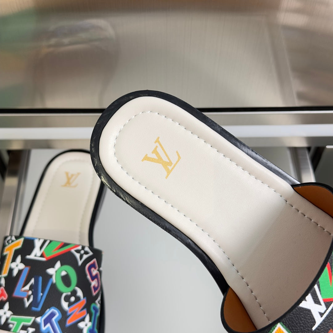 Louis Vuitton slide sandal strap close-up with black trim and white footbed