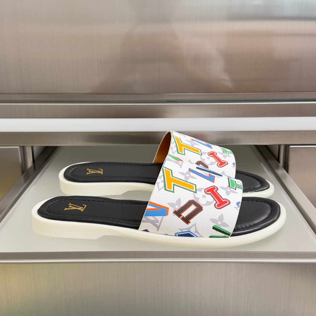 Black slide sandals with multicolor monogram strap and gold LV logo