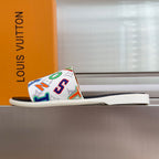 Slide sandals with multicolor monogram strap on a white sole