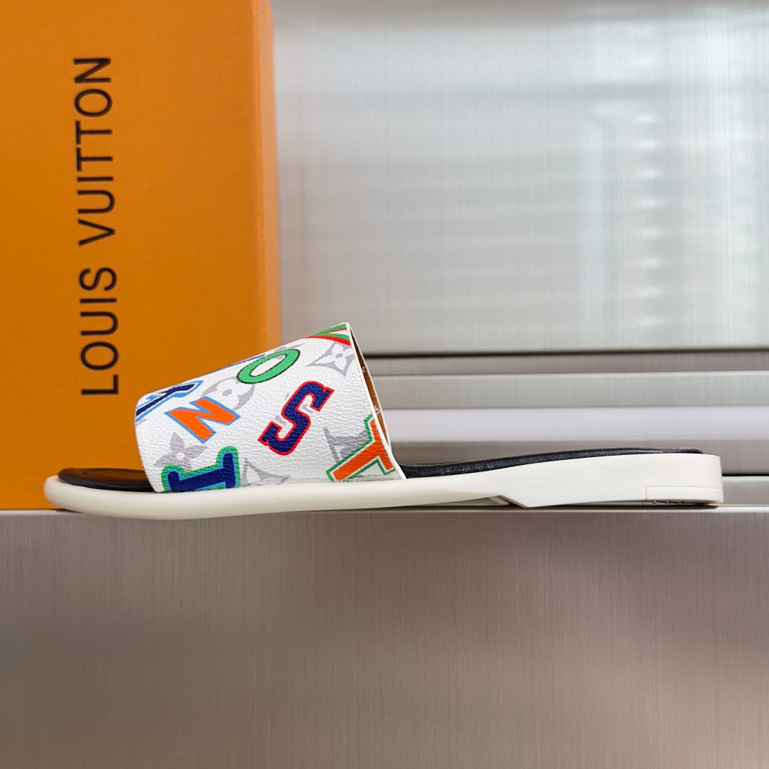 Slide sandals with multicolor monogram strap on a white sole