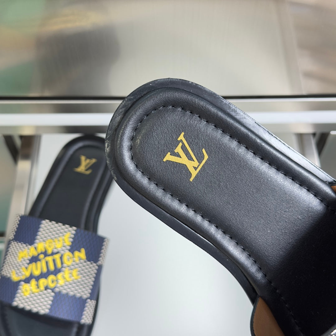 Louis Vuitton sandal strap close-up on black leather with gold LV logo
