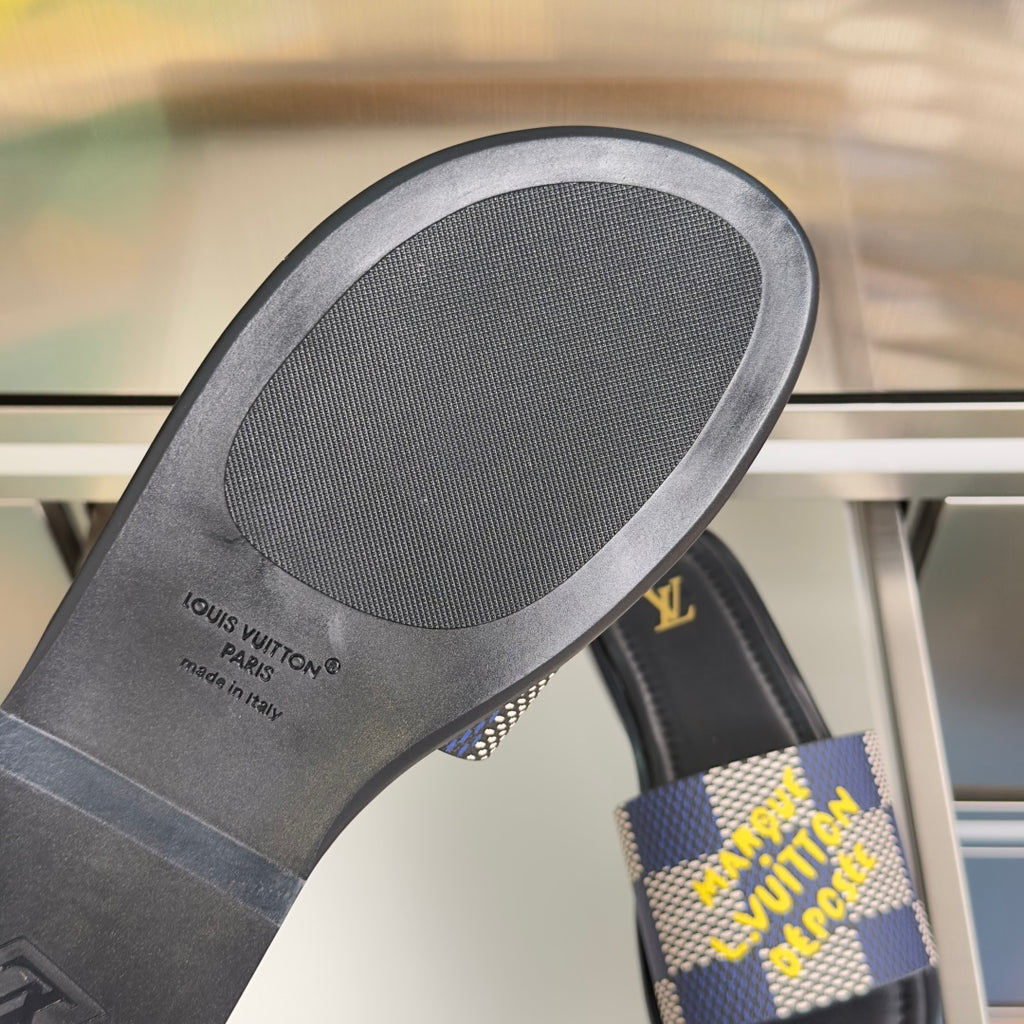 Louis Vuitton slide sandal footbed close-up with Louis Vuitton Paris logo text